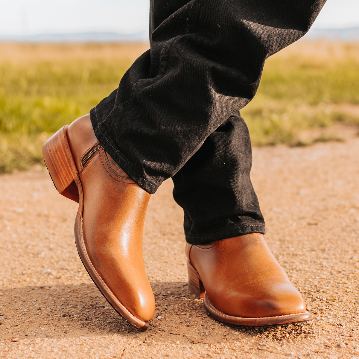 FREEBIRD men's Tifton camel single exterior pull strap, squared toe, and inside zip closure low heeled mid calf boot lifestyle