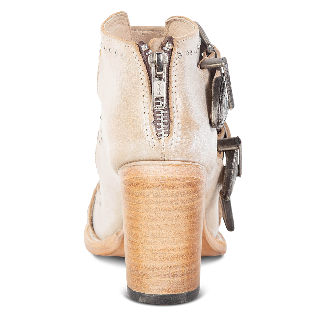 Back view showing working brass zip closure and leather heel on FREEBIRD women's Violet beige sandal