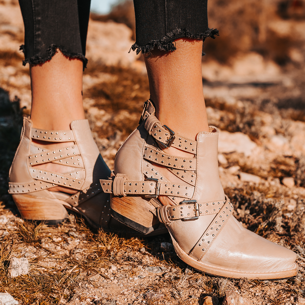 FREEBIRD women's Wasp beige ankle bootie with exposed sides, adjustable fastener metal buckles, working back zip closure, snip toe, and traditional snip toe
