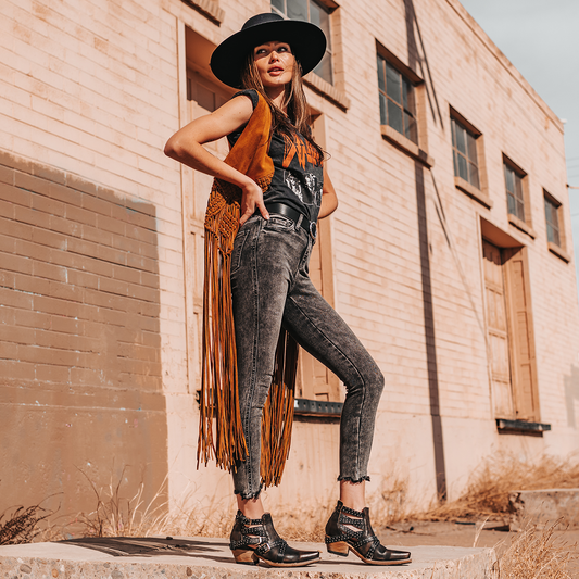 FREEBIRD women's Wasp black ankle bootie with exposed sides, adjustable fastener metal buckles, working back zip closure, snip toe, and traditional snip toe lifestyle