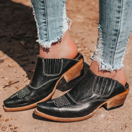 FREEBIRD women's Wentworth black western mule featuring elastic gore, stitch detailing, open back, and snip toe