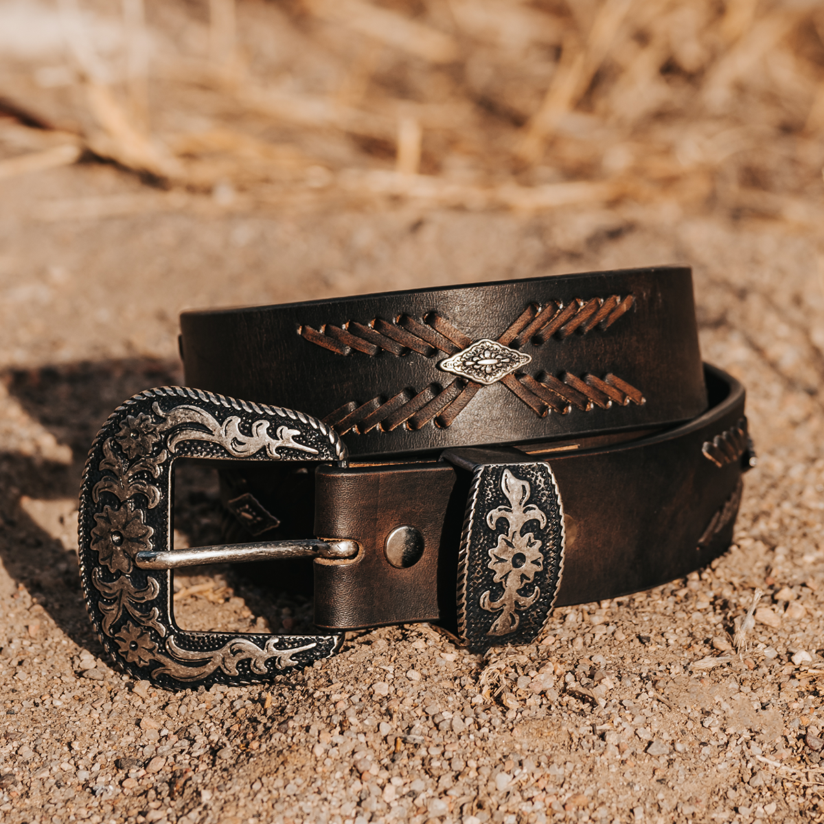 FREEBIRD Westbound black distressed full grain leather belt featuring embroidered leather detailing and engraved hardware lifestyle