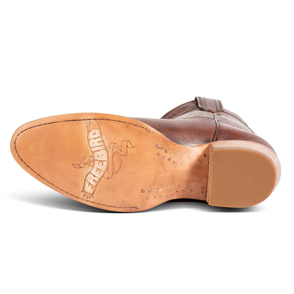 Leather sole imprinted with FREEBIRD on women's Zamora cognac leather bootie