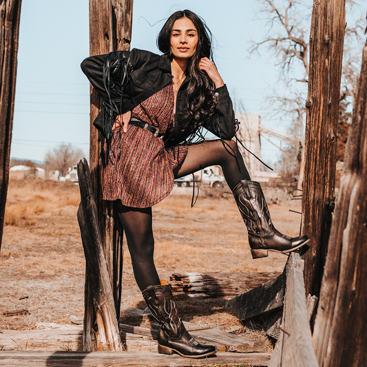 FREEBIRD women's Zion black slim fit mid calf boot with stud detailing, almond-shaped toe, low heel, and pull on straps lifestyle