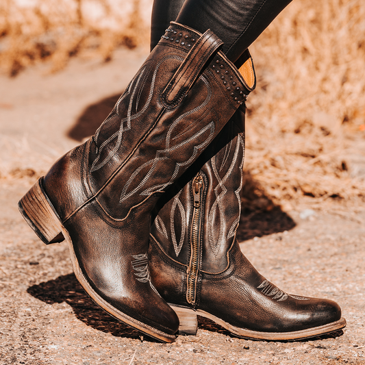 FREEBIRD women's Zion black slim fit mid calf boot with stud detailing, almond-shaped toe, low heel, and pull on straps