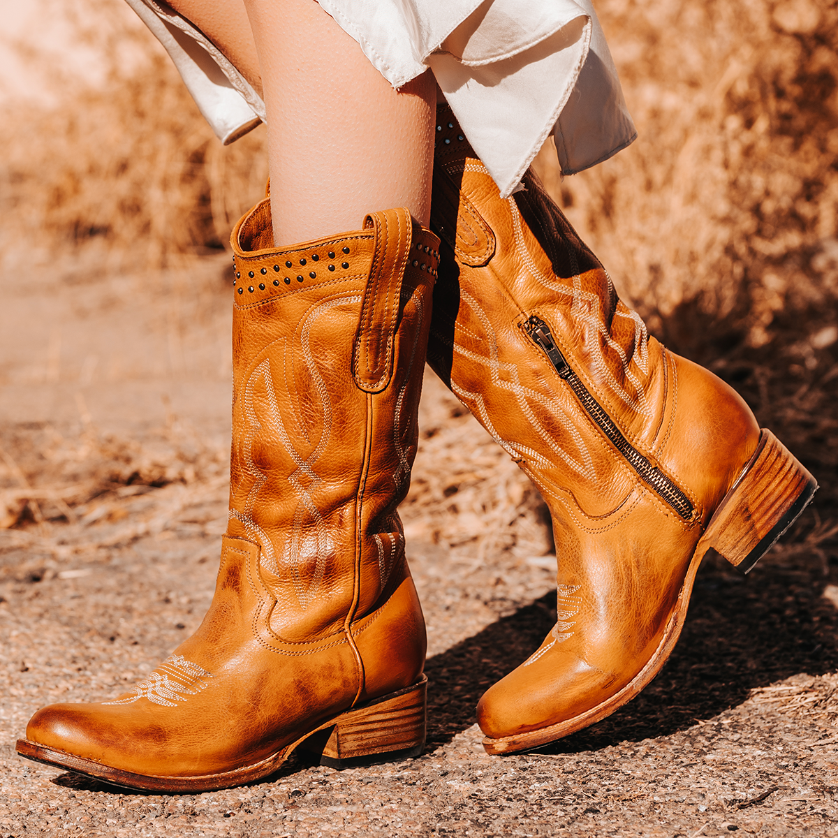FREEBIRD women's Zion wheat slim fit mid calf boot with stud detailing, almond-shaped toe, low heel, and pull on straps