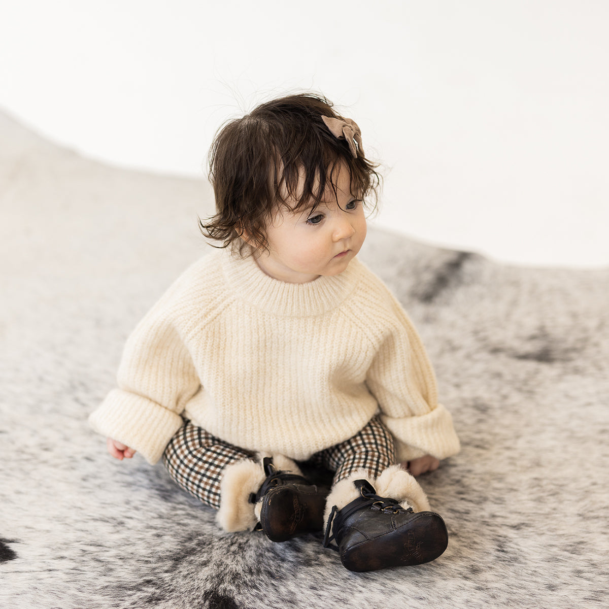 FREEBIRD infant baby Norway dark olive shearling lined leather bootie with front lacing lifestyle image