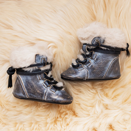 FREEBIRD infant baby Norway ice shearling lined leather bootie with front lacing lifestyle image