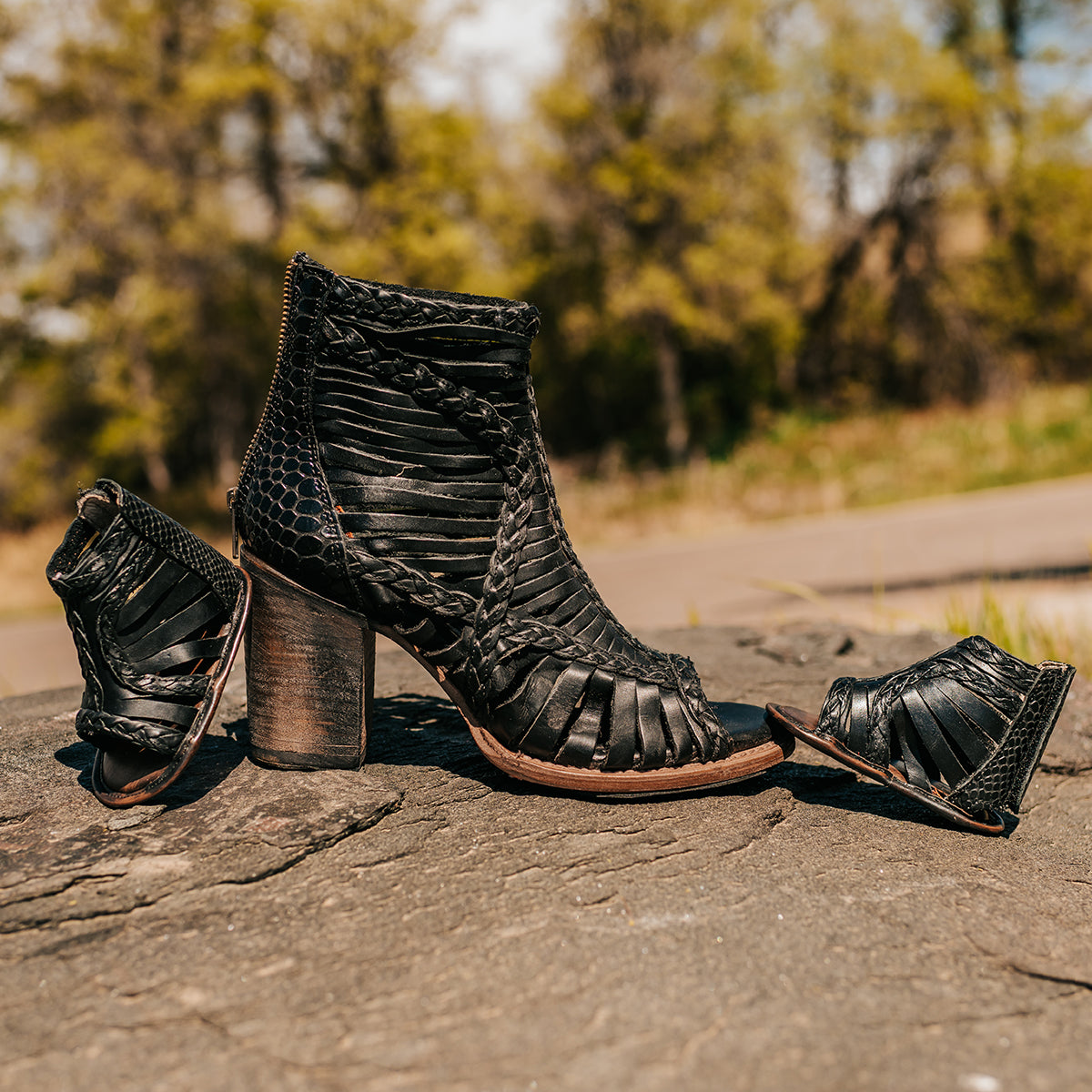 FREEBIRD infant baby bela black sandal with laser-cut leather, braided accents and a back velcro panel.