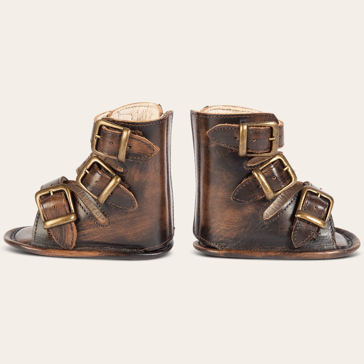 side view showing buckle fashion straps on FREEBIRD infant baby bond red croco sandal