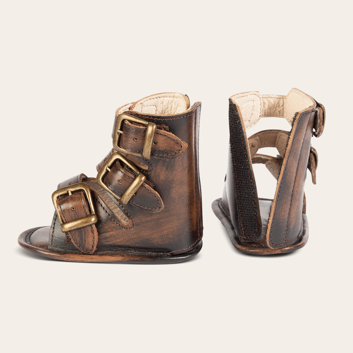 side and back view showing buckle fashion straps and back leather velcro panel on FREEBIRD infant baby bond black sandal
