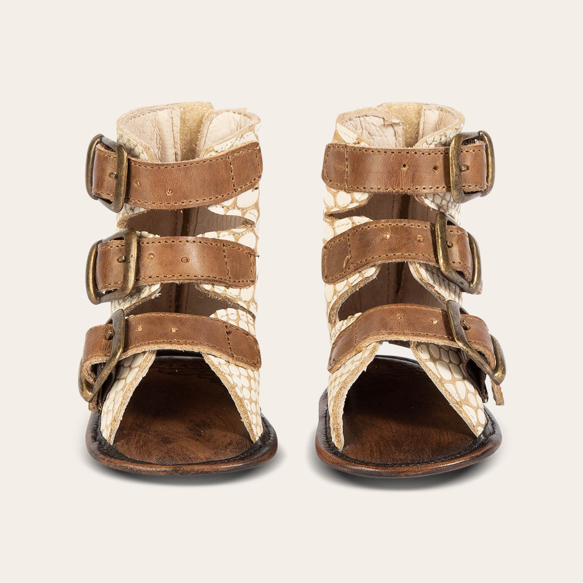 front view showing buckle fashion straps on FREEBIRD infant baby bond white snake sandal