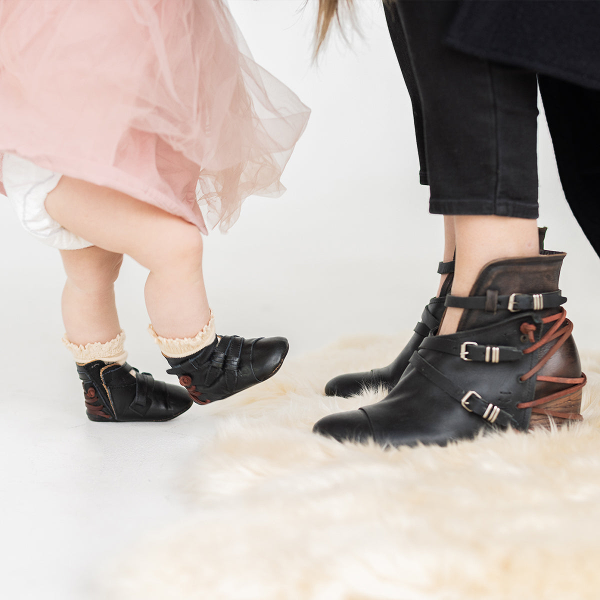 FREEBIRD infant baby crue black back lace detailing and side strap detailing leather bootie with inside velcro closure lifestyle image