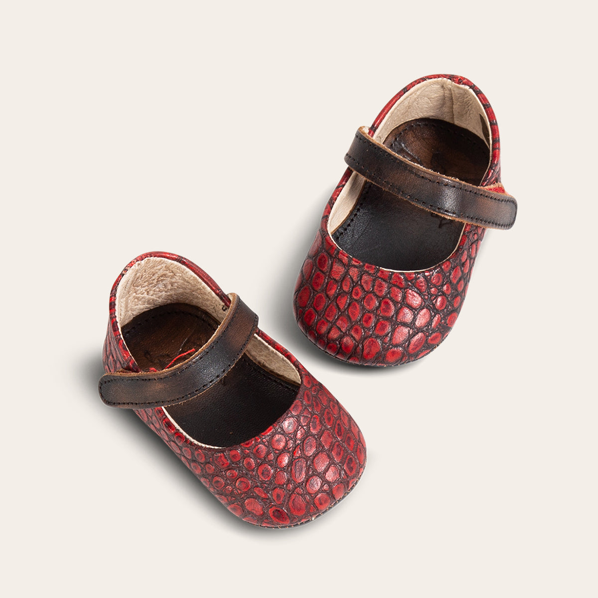 front and side view showing top leather strap on FREEBIRD infant baby Jane red croco leather shoe