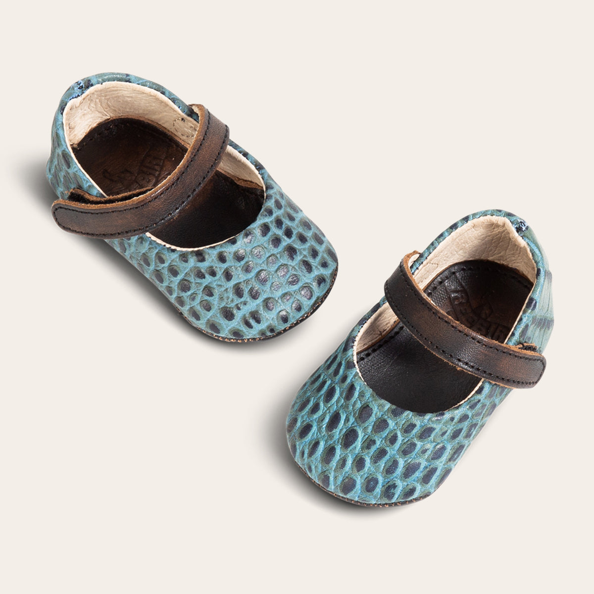 top view showing top leather strap on FREEBIRD infant baby Jane turquoise croco leather shoe