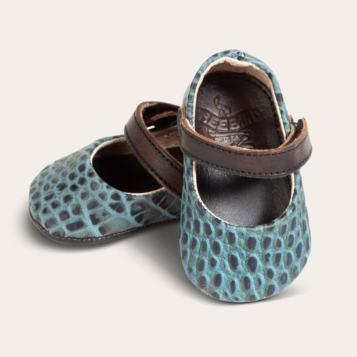front view showing top leather strap on FREEBIRD infant baby Jane turquoise croco leather shoe