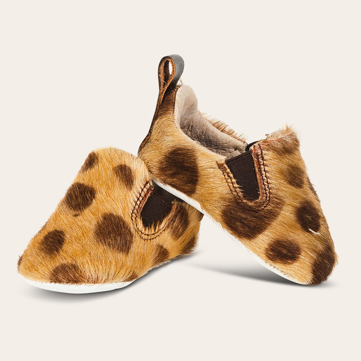 front view showing heel pull tab and side elastic panel on FREEBIRD infant baby kicks leopard leather shoe
