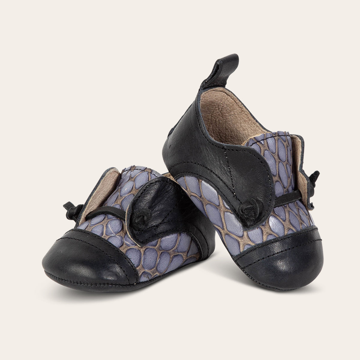 front view showing contrasting decorative knotted leather lace on FREEBIRD infant baby Mabel navy multi leather shoe  