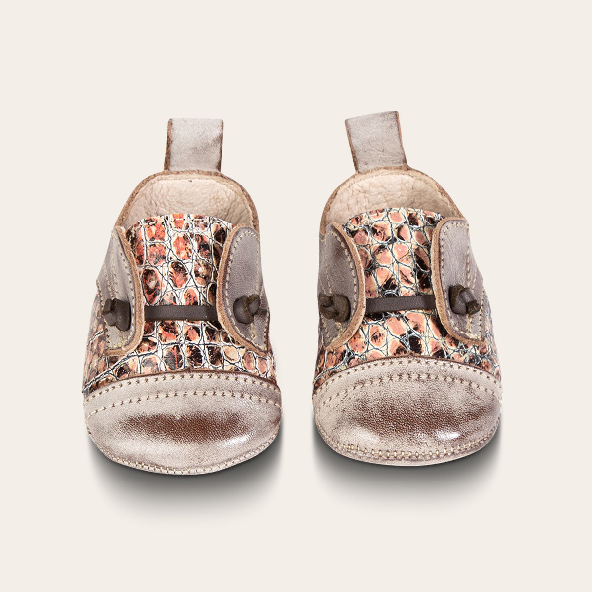 front view showing contrasting decorative knotted leather lace on FREEBIRD infant baby Mabel pink multi leather shoe