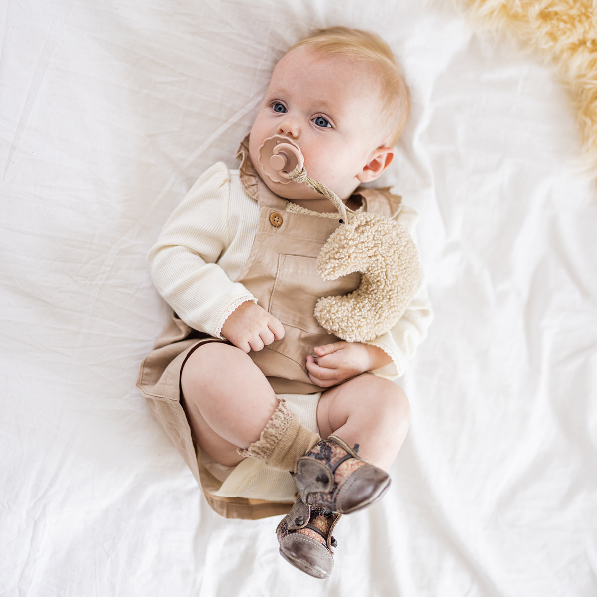 FREEBIRD infant baby Mabel pink multi leather shoe with decorative knotted leather lace and hidden inside elastic panel lifestyle image