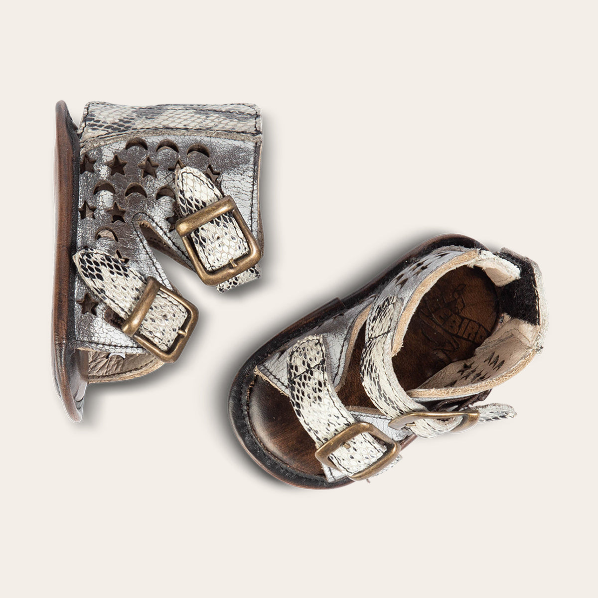 top view showing laser-cut leather, embossed fashion straps, back velcro panel on FREEBIRD infant baby teresa ice leather sandal