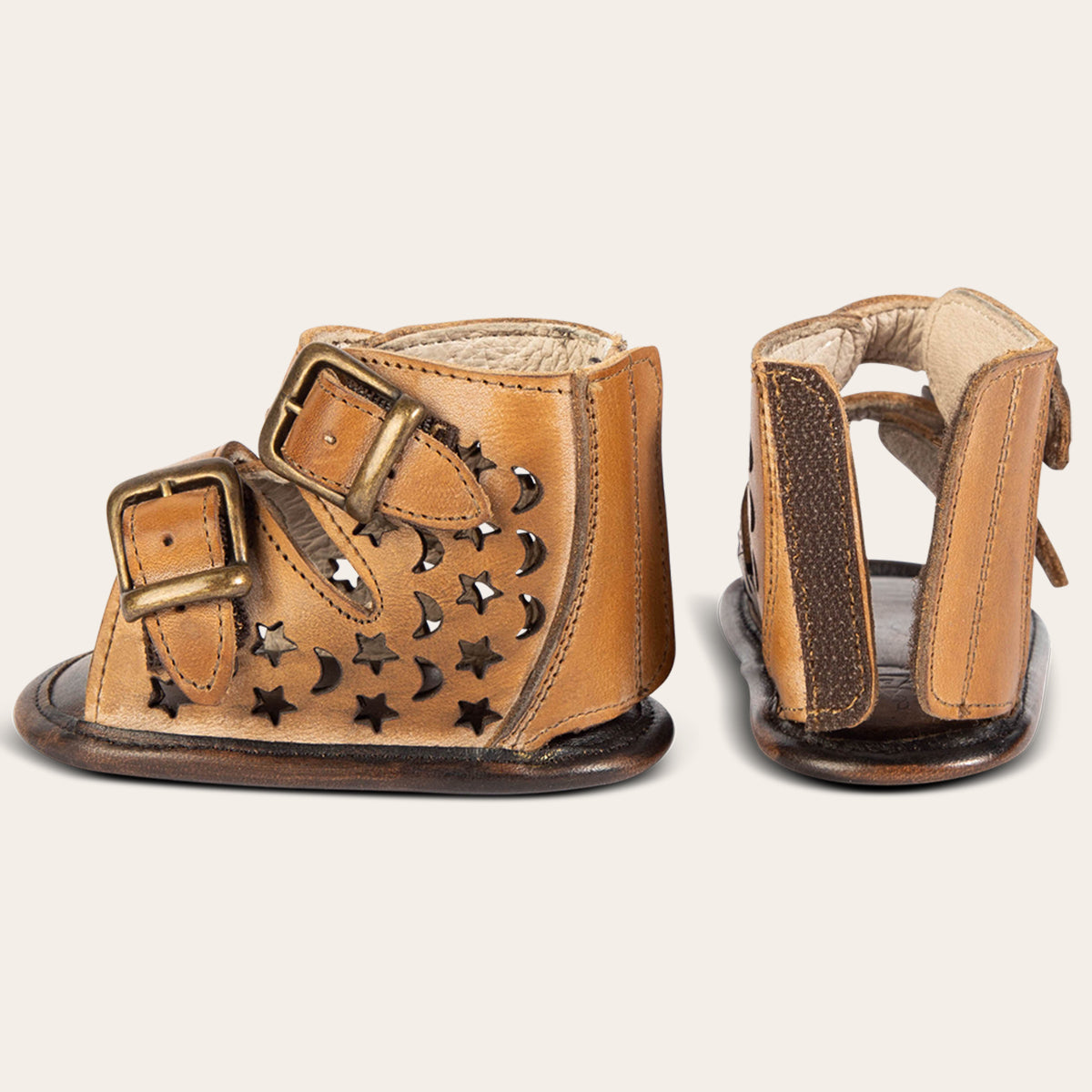 back and side view showing laser-cut leather, embossed fashion straps, back velcro panel on FREEBIRD infant baby teresa tan leather sandal